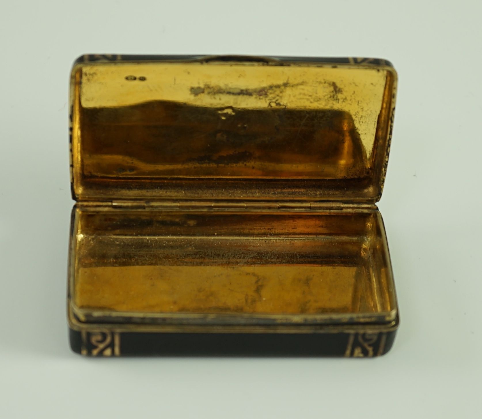 A late 1920's French Cartier silver gilt, black enamel and diamond set snuff box, in fitted gilt tooled leather Cartier box